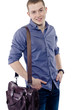 Casual young man in jeans and shirt smiling over white backgroun