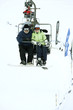 Couple traveling on chair lift