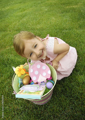 Photo: Girl with her pail of toys Girl with her pail of toys