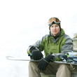 Man posing with his snowboard