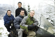 Men posing on snowmobile