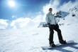 Male snowboarder posing for the camera