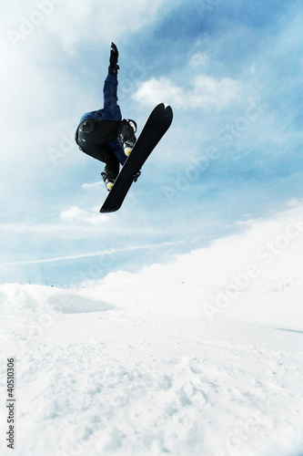 Photo: Male snowboarder in air Male snowboarder in air
