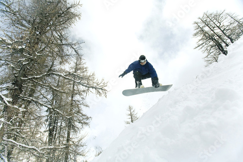 Photo: Male snowboarder in air Male snowboarder in air