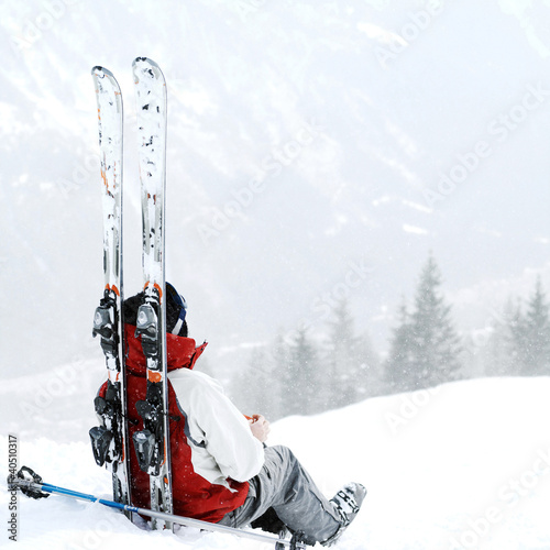 Photo: Skier sitting alone Skier sitting alone