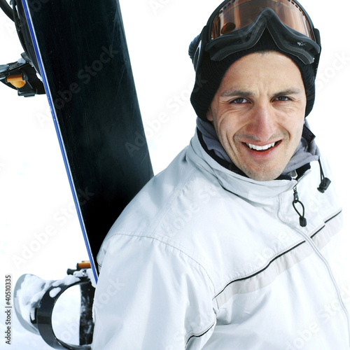 Photo: Male snowboarder smiling at the camera Male snowboarder smiling at the camera