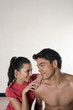 Man and woman smiling while looking at each other