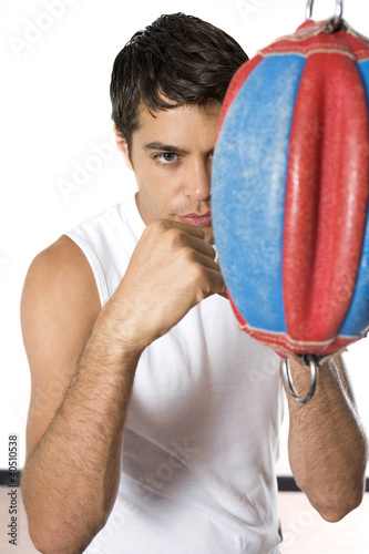 Photo: Man training with punching bag Man training with punching bag