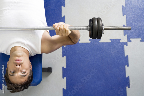 Photo: Man lifting barbell Man lifting barbell