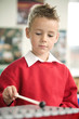 Boy playing xylophone