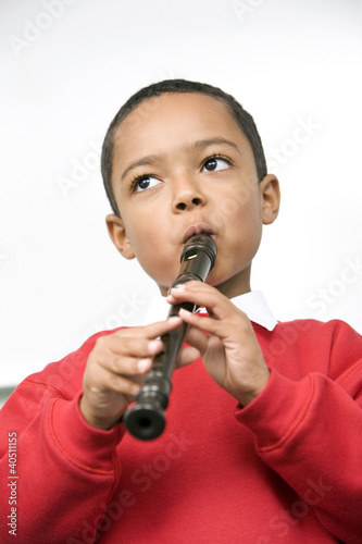 Photo: Boy playing the recorder Boy playing the recorder