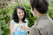 Man and woman toasting with glasses of juice