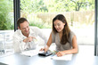 Man and woman working out some calculations together