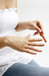 Woman filing her nails