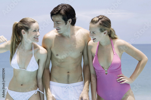 Photo: Man and women in swimwear having fun Man and women in swimwear having fun