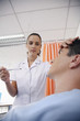 Nurse checking man's temperature