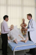 Doctors having discussion, dummy patient on the bed