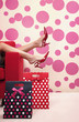 Woman's legs on the sofa's arm rest