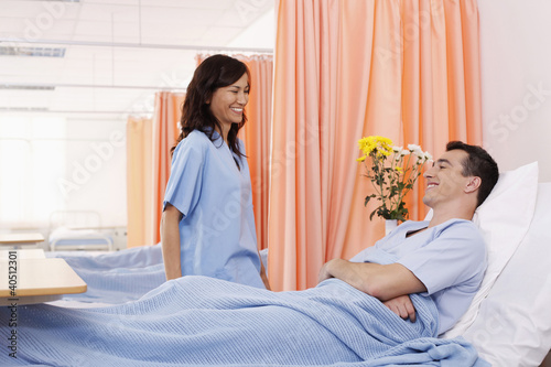 Photo: Woman visiting man at his ward Woman visiting man at his ward