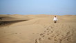 Video: Young happy man walking on the desert Young happy man walking on the desert