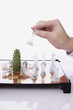 Hand holding a chess piece