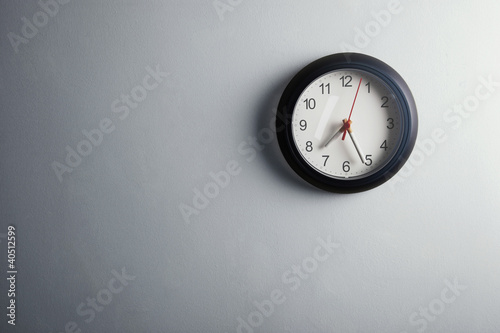 Photo: Clock hanging on the wall with cigarettes as the needles Clock hanging on the wall with cigarettes as the needles