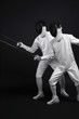 Two men with fencing foils