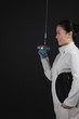 Woman with fencing foil