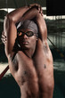 Man with swimming cap and goggles posing for the camera