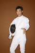 Man in fencing suit extending hand for a handshake