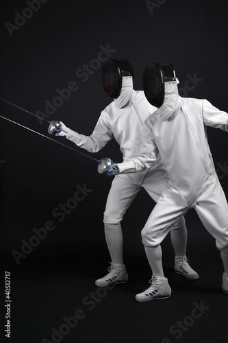 Photo: Two men with fencing foils Two men with fencing foils