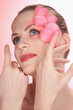 Woman with flower petals decorating her face