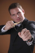Businessman using slingshot