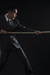 Photo: Businessman pulling a rope Businessman pulling a rope