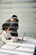 Businessman putting his hands on businesswoman's shoulders