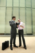 Businessman and businesswoman having discussion