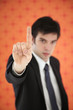 Businessman showing his index finger