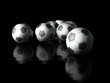 Group of football in dark background 3d objects