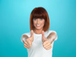attractive woman smiling with her thumbs up