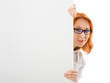 Young businesswoman showing blank signboard.