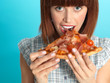 Photo: beautiful young woman eating a pizza pie beautiful young woman eating a pizza pie