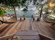 Seculed terrace with wooden hammocks