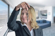 Woman is blinking eye and showing her new house keys Woman is blinking eye and showing her new house keys