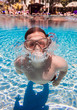 teenager floats in pool