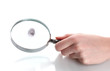 Magnifying glass in hand and fingerprint isolated on white
