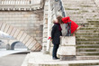 Beautiful romantic couple kissing on a Parisian embankment at sp