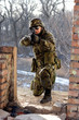 Foto: Soldier sitting near wall with a gun Soldier sitting near wall with a gun