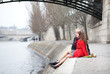 Romantic couple in love having a date near Pont des Arts in Pari
