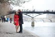 Romantic couple in love dating near Pont des Arts in Paris