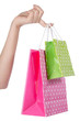 A fényképek részletei bright gift bags in hand isolated on white